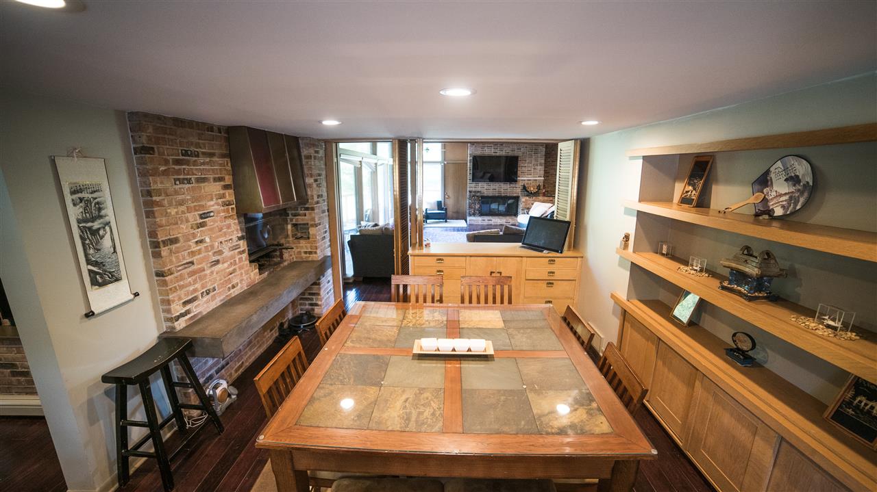 3802 Brookview Road Rockford, IL 61107 - Photo 7 of 25 a living room with stainless steel appliances dining table furniture and a flat screen tv
