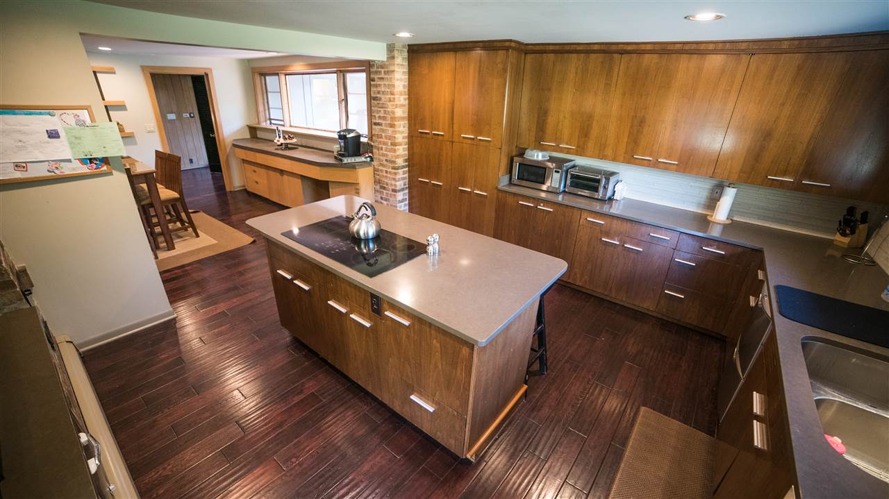 3802 Brookview Road Rockford, IL 61107 - Photo 9 of 25 a kitchen with stainless steel appliances granite countertop a stove a sink and a refrigerator