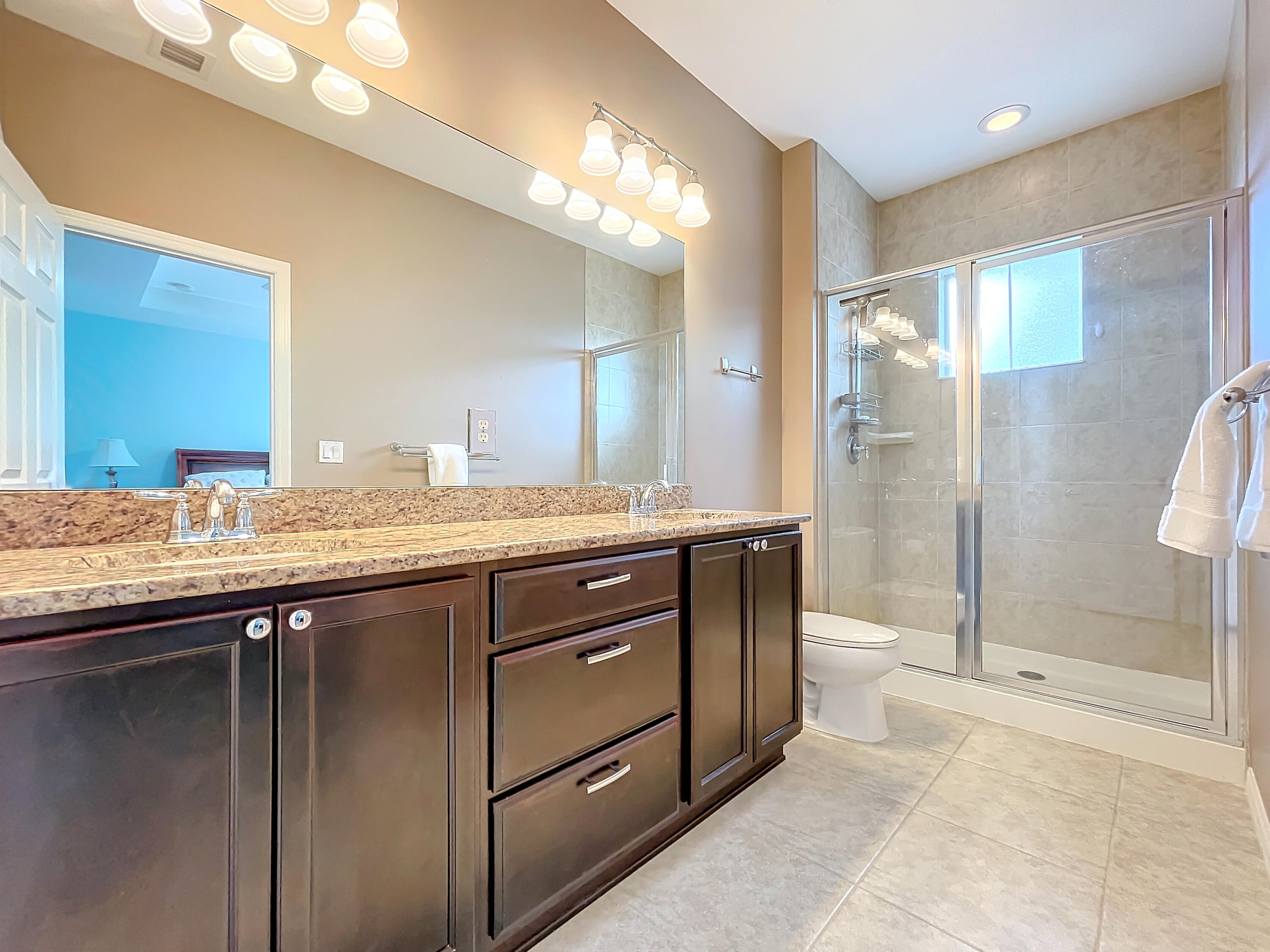 2742 Avalon Way Jupiter, FL 33458 - Photo 18 of 48 a bathroom with a granite countertop sink mirror and shower