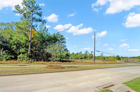 a view of a building and a cars park