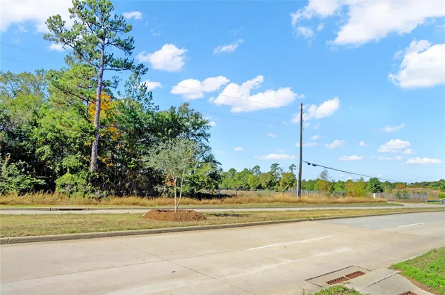 a view of a building and a cars park