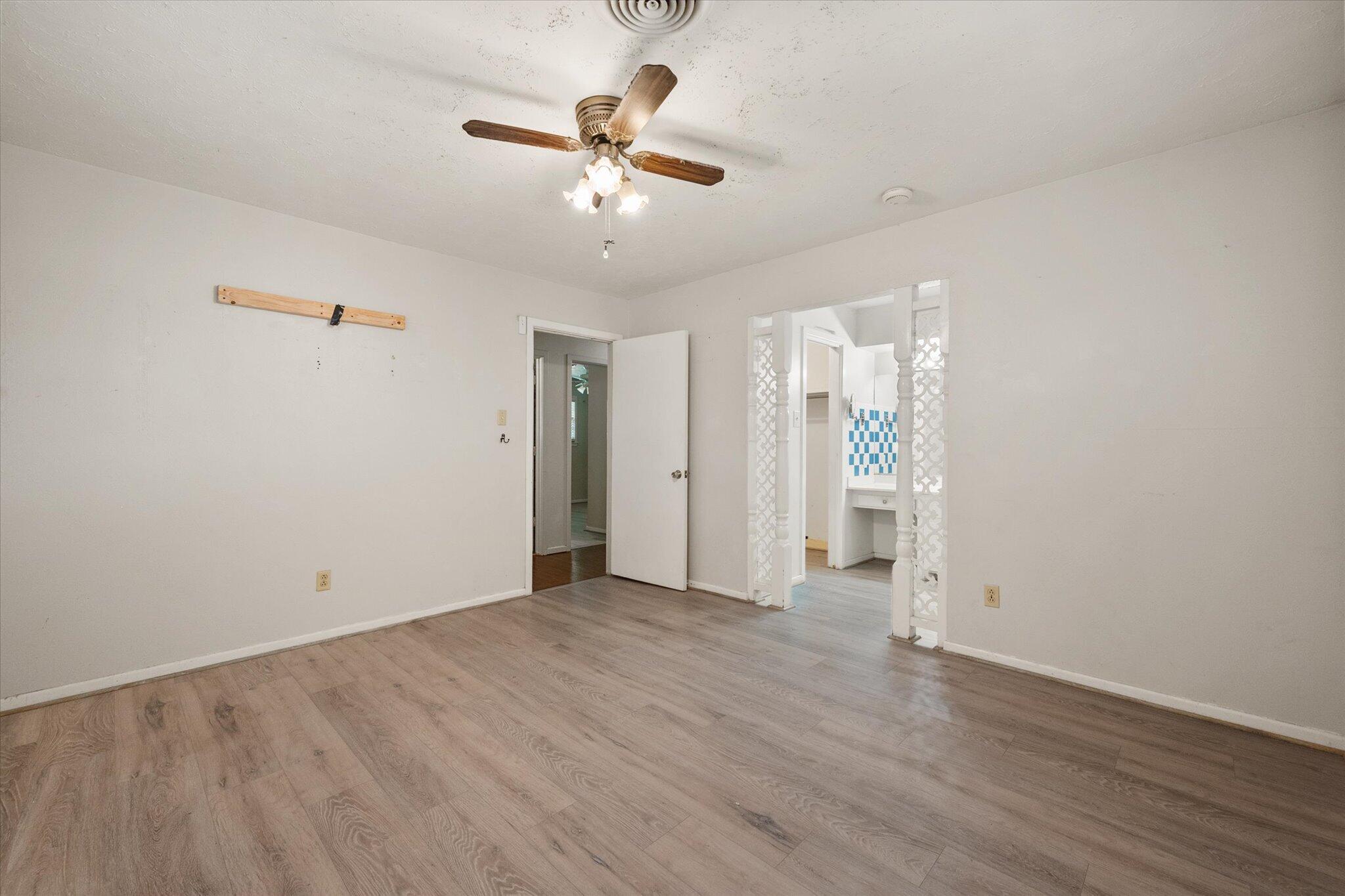 4604 27th Street Lubbock, TX 79410 - Photo 14 of 36 wooden floor in an empty room with a window