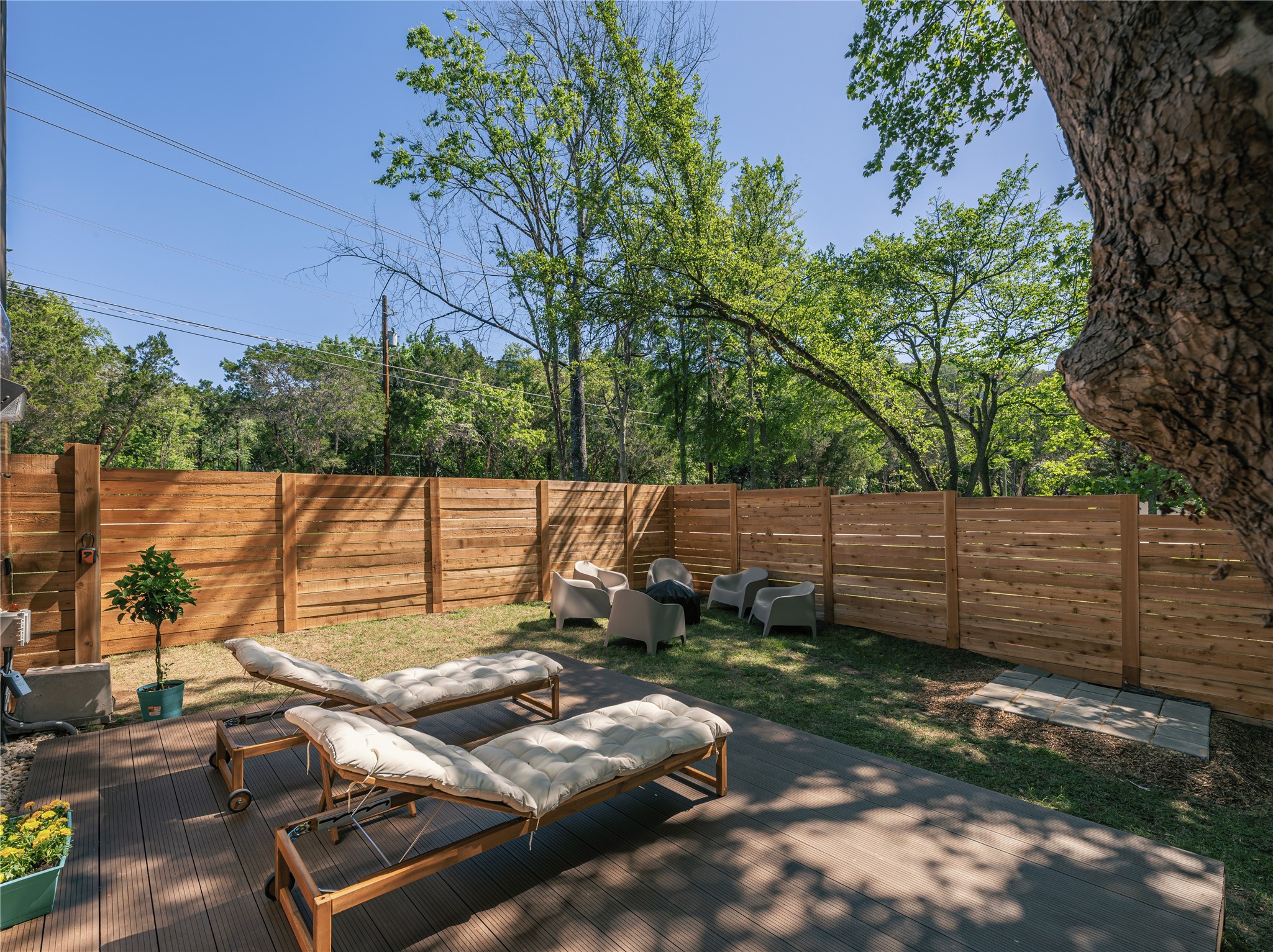 2806 Geronimo Trail Austin, TX 78734 - Photo 35 of 36 a view of a backyard with chairs and a fire pit