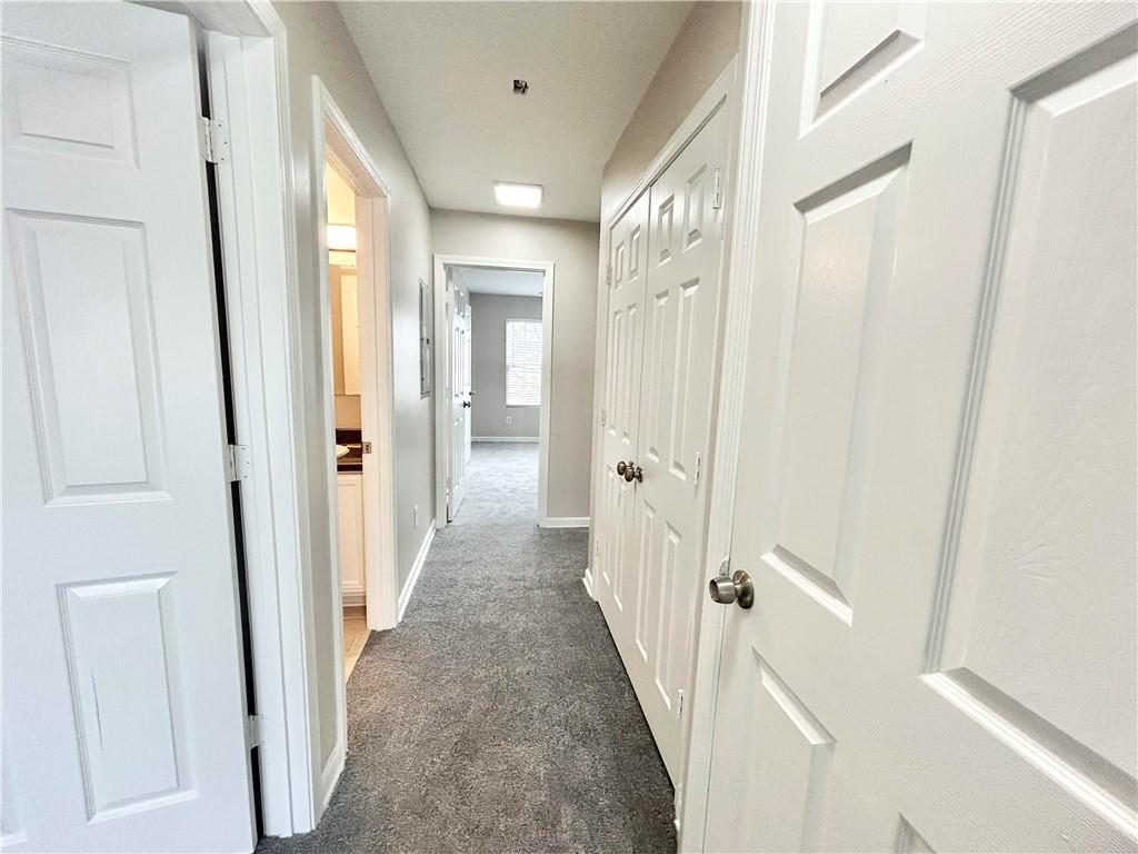 1026 Wheel House Lane, Unit H Monroe, GA 30655 - Photo 6 of 13 a view of a hallway with a door and staircase
