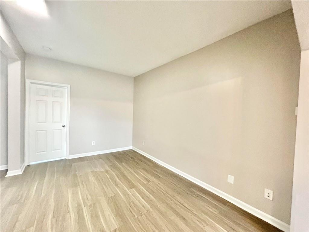 1026 Wheel House Lane, Unit H Monroe, GA 30655 - Photo 7 of 13 a view of an empty room