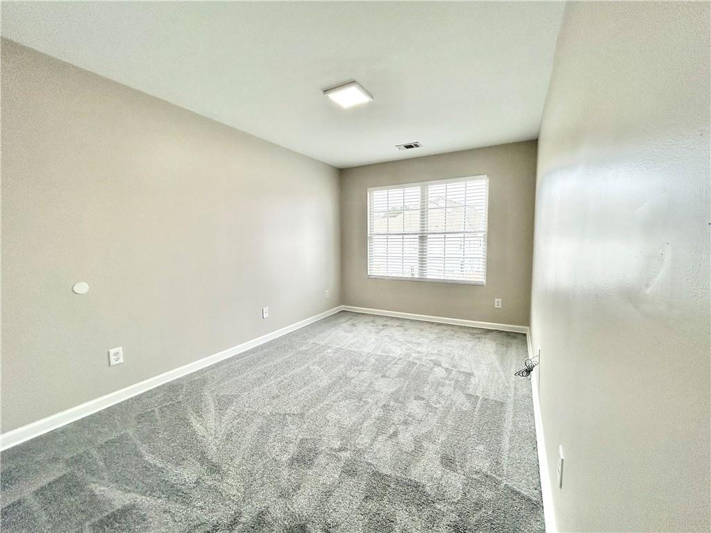 1026 Wheel House Lane, Unit H Monroe, GA 30655 - Photo 10 of 13 an empty room with window