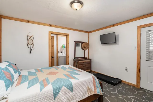 a bathroom with a sink mirror and toilet