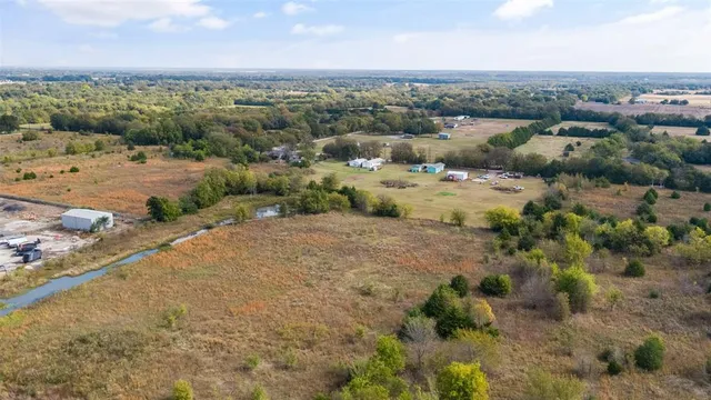 an aerial view of a houses with outdoor space