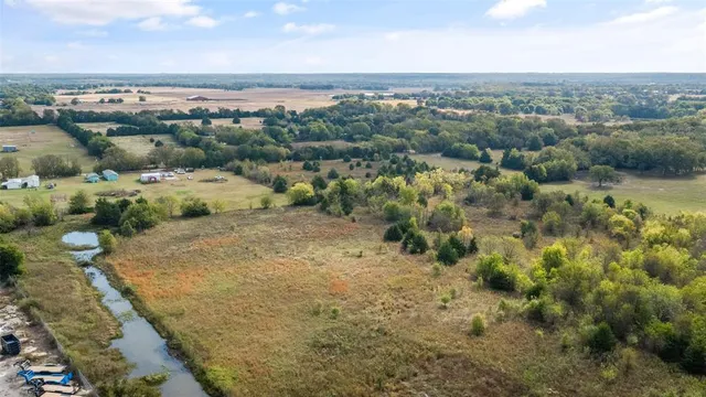 an aerial view of a houses with outdoor space