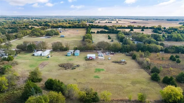 an aerial view of a houses with a lake view