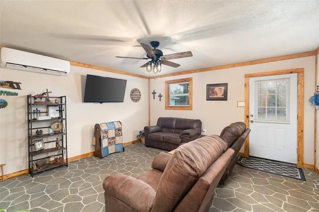 a living room with furniture a couch and a chandelier