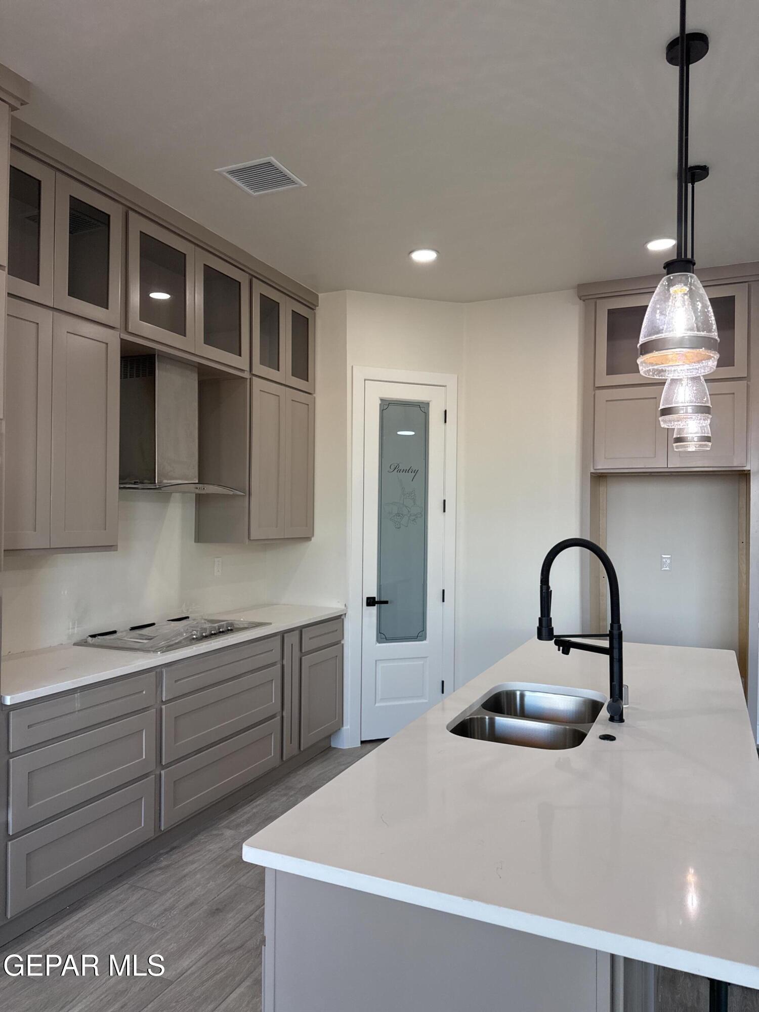 3904 Surmise Street El Paso, TX 79938 - Photo 12 of 21 a kitchen with a sink and appliances