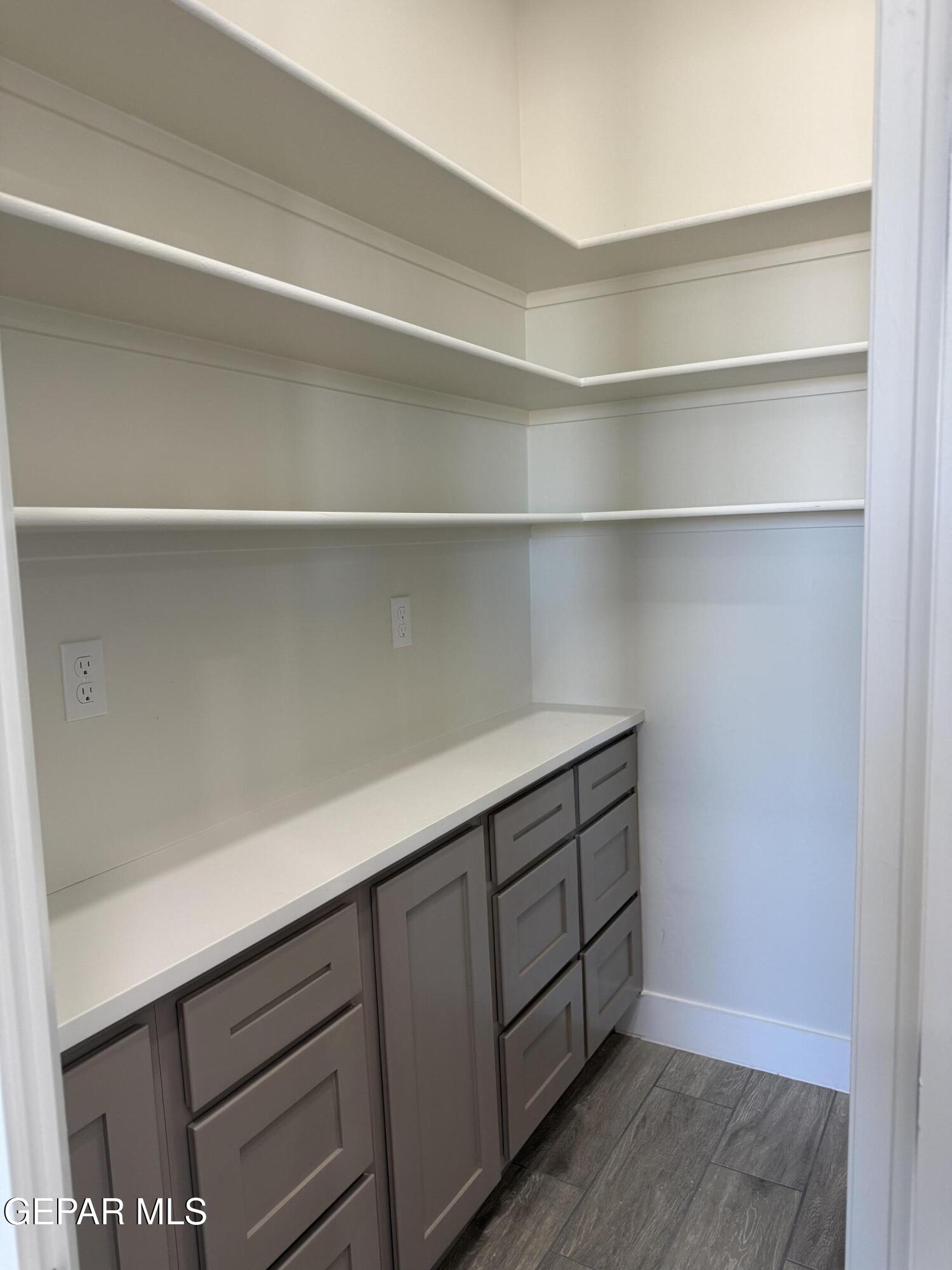 3904 Surmise Street El Paso, TX 79938 - Photo 13 of 21 a room with a closet and wooden floor