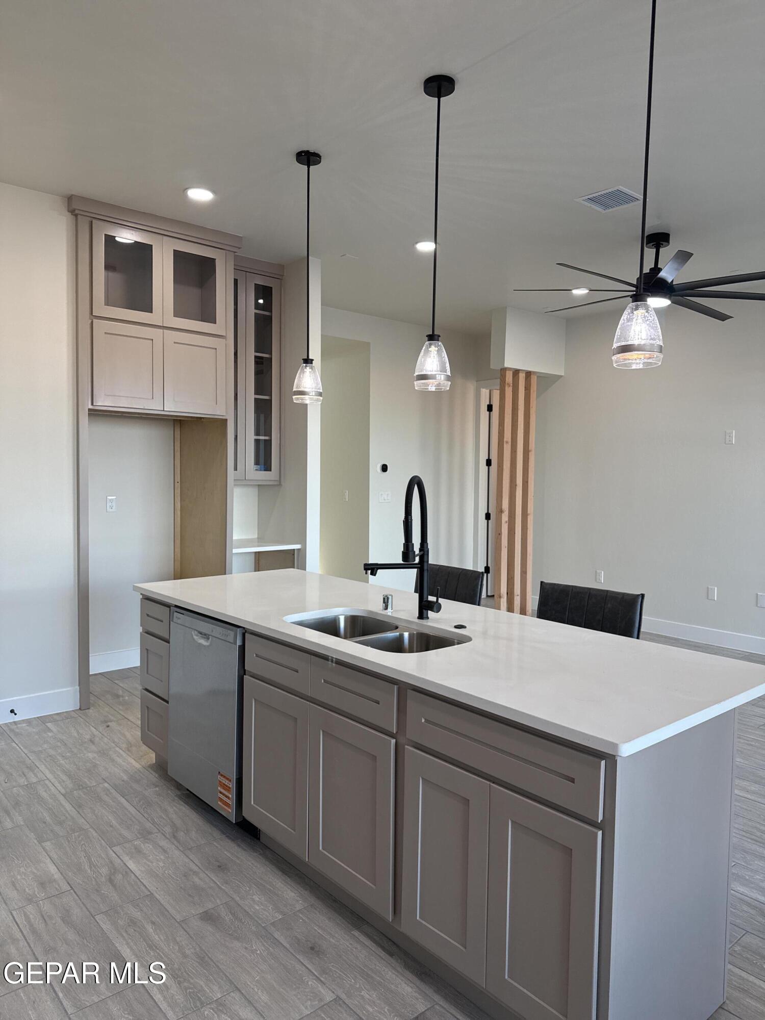 3904 Surmise Street El Paso, TX 79938 - Photo 14 of 21 a kitchen with a sink a counter space appliances and cabinets