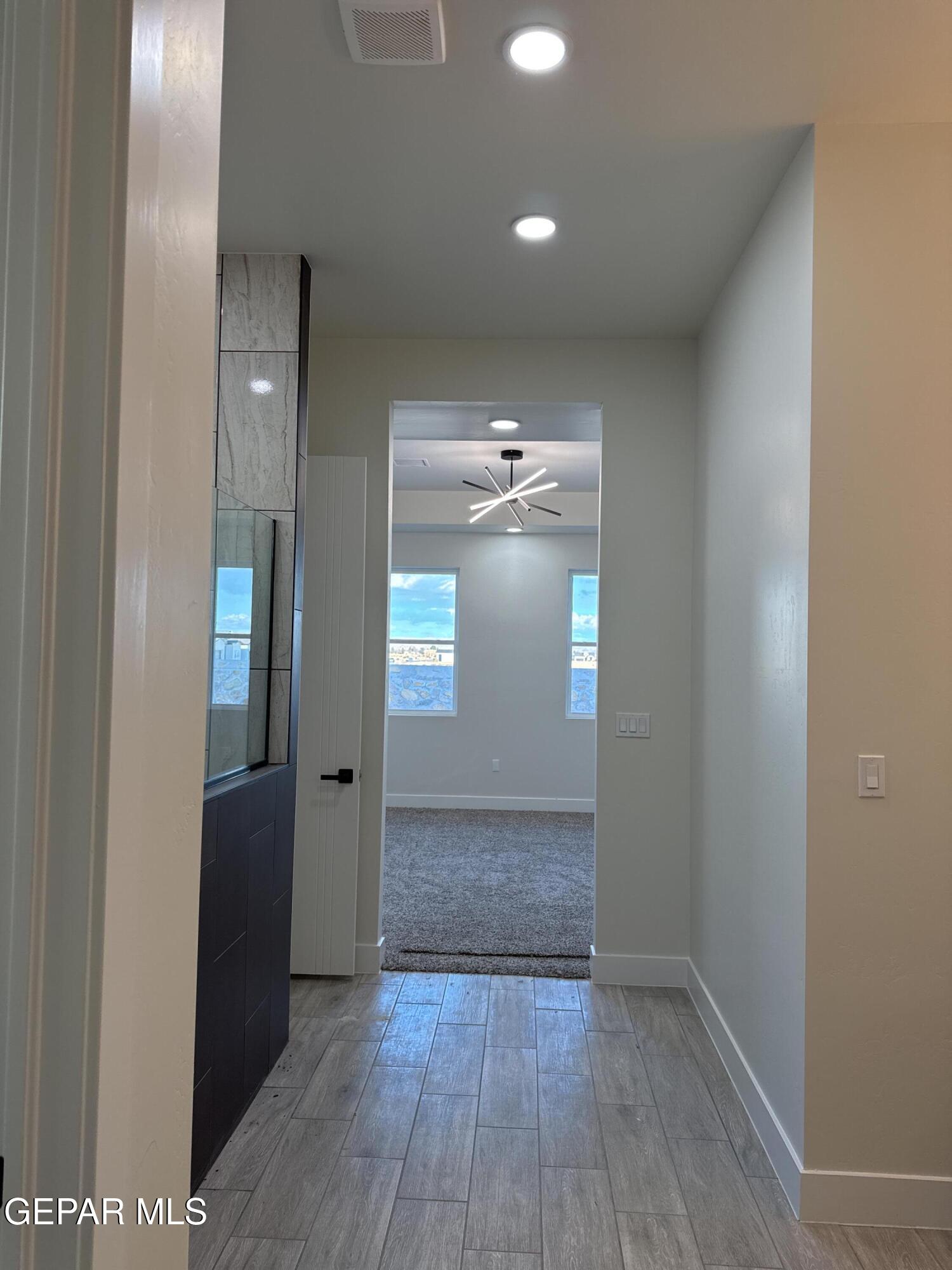 3904 Surmise Street El Paso, TX 79938 - Photo 9 of 21 a view of empty room with wooden floor