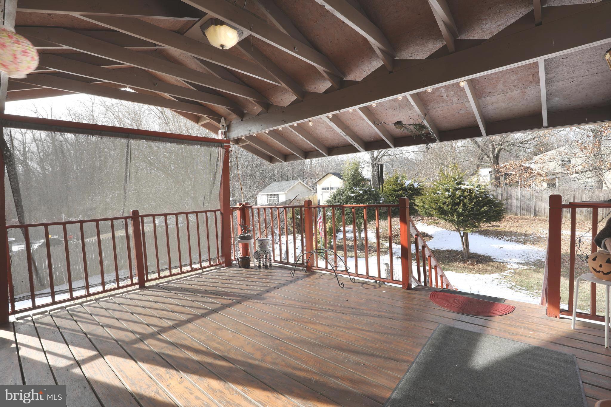 1320 Rainbow Drive Silver Spring, MD 20905 - Photo 12 of 26 Deck overlooking lush landscaped yard