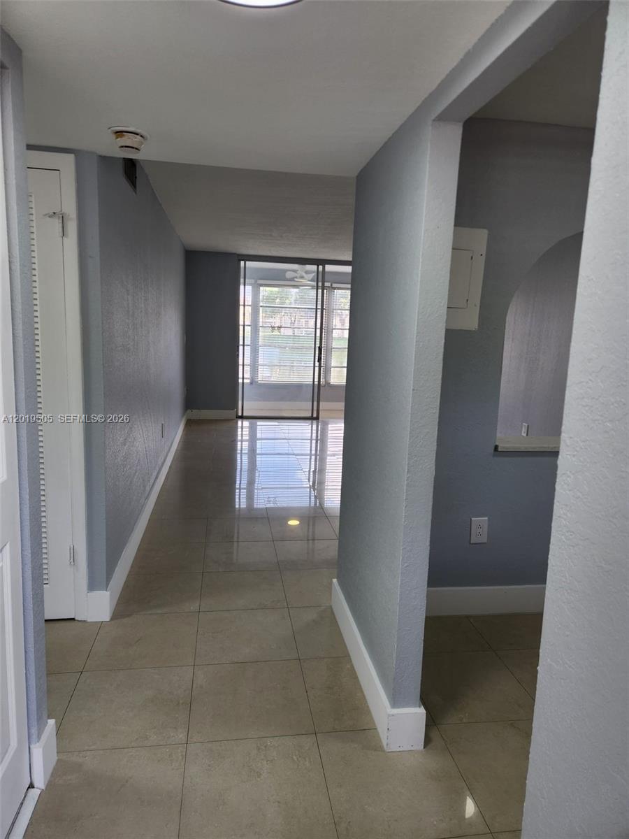 2811 North Pine Island Road, Unit 107 Sunrise, FL 33322 - Photo 5 of 16 a view of entryway