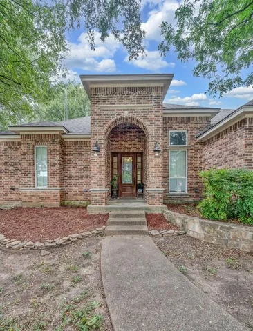 a front view of a house with yard