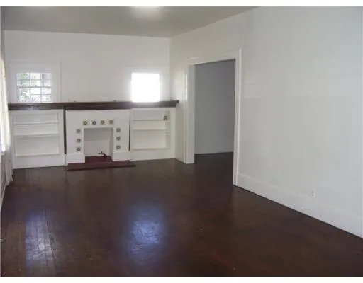 a view of a livingroom with wooden floor