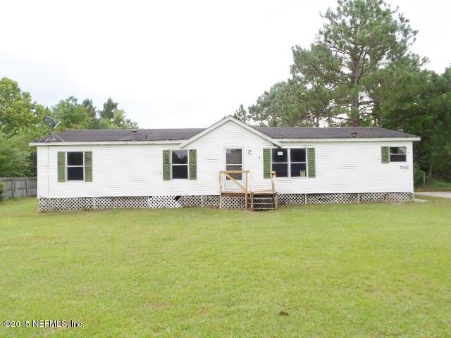 3150 Raulerson Road St. Augustine, FL 32092 - Photo 1 of 19 a backyard of a house with wooden floor and fence