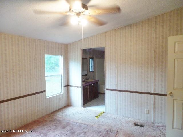 3150 Raulerson Road St. Augustine, FL 32092 - Photo 11 of 19 a view of an empty room with a window