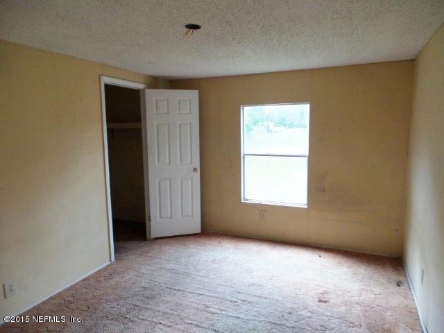 3150 Raulerson Road St. Augustine, FL 32092 - Photo 15 of 19 an empty room with a window