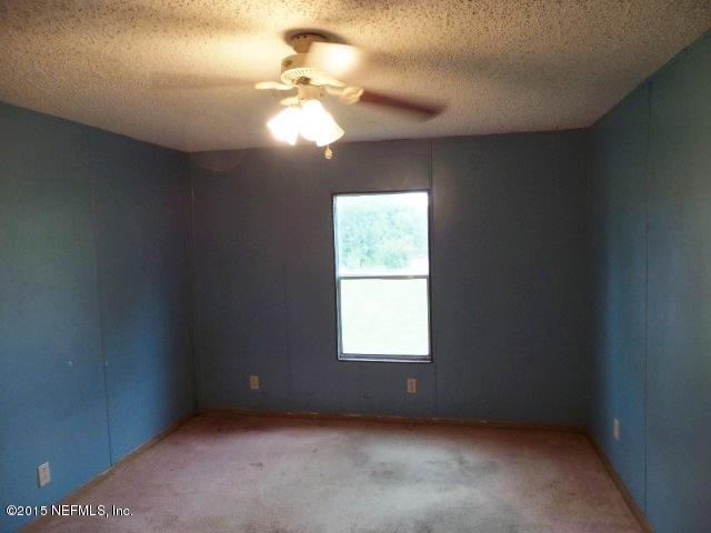 3150 Raulerson Road St. Augustine, FL 32092 - Photo 18 of 19 an empty room with a window