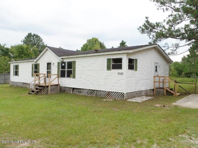 3150 Raulerson Road St. Augustine, FL 32092 - Photo 19 of 19 a view of a house with a yard and sitting area