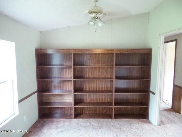 3150 Raulerson Road St. Augustine, FL 32092 - Photo 6 of 19 a view of an empty room with empty racks