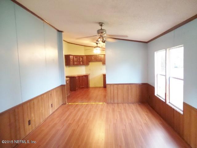 3150 Raulerson Road St. Augustine, FL 32092 - Photo 8 of 19 a view of empty room with wooden floor and fan