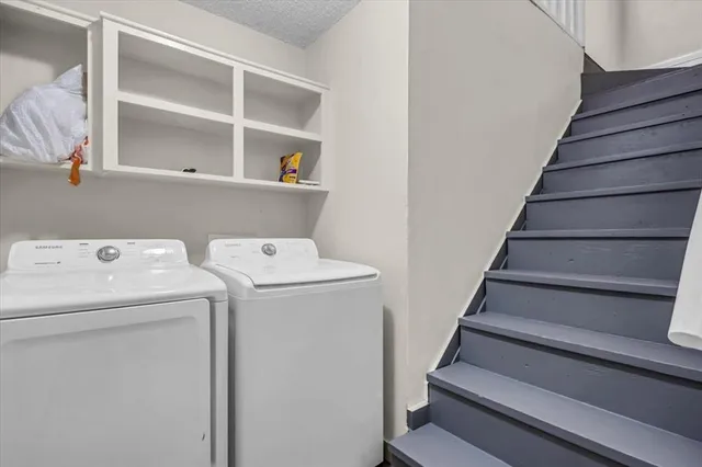 a view of storage and utility room with washer and dryer