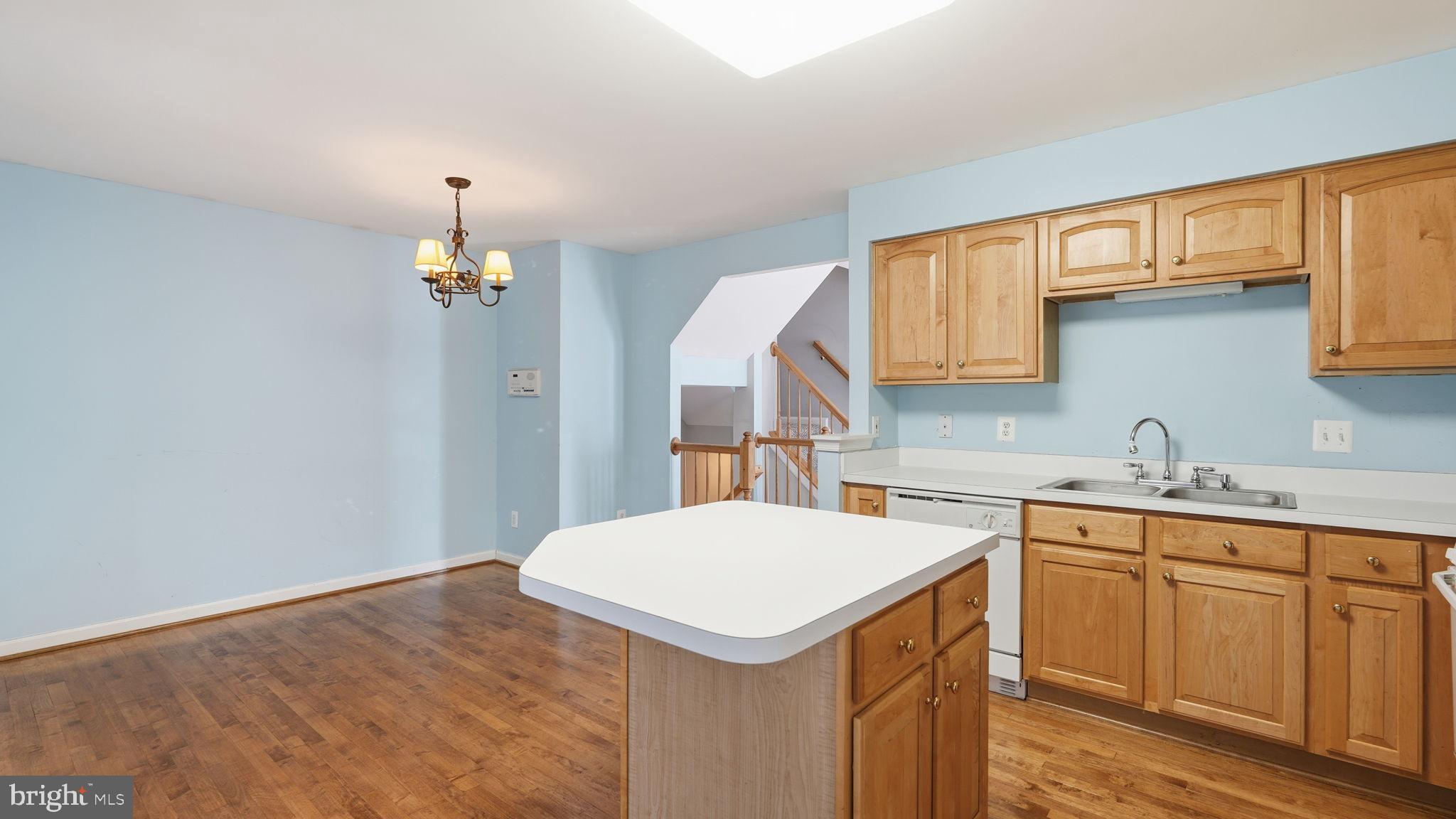 14431 Colonel Wood Road Gainesville, VA 20155 - Photo 13 of 37 a kitchen with a sink a cabinets and window