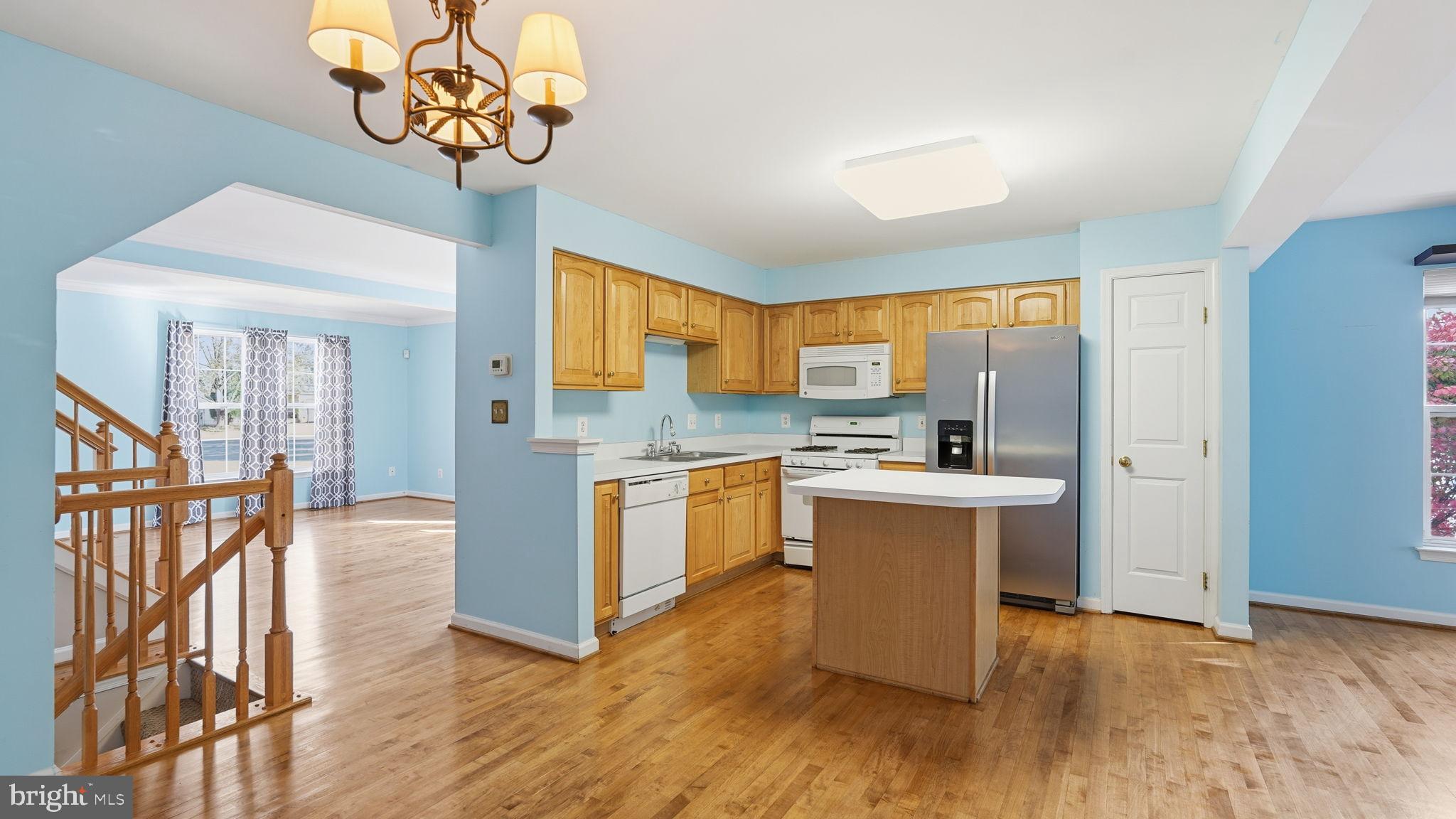 14431 Colonel Wood Road Gainesville, VA 20155 - Photo 16 of 37 a kitchen with a sink appliances and cabinets