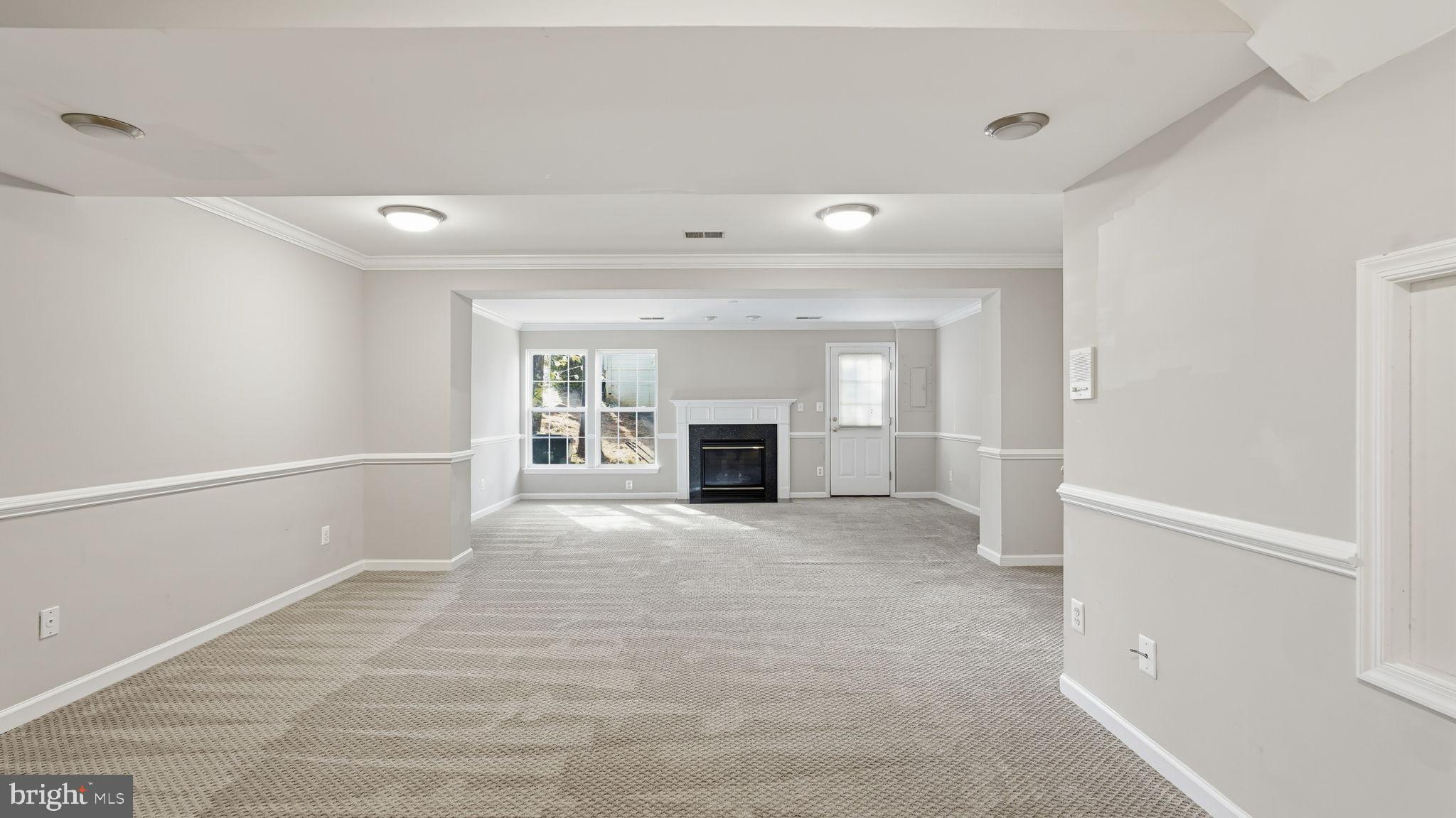 14431 Colonel Wood Road Gainesville, VA 20155 - Photo 24 of 37 a view of empty room with a fireplace and a window