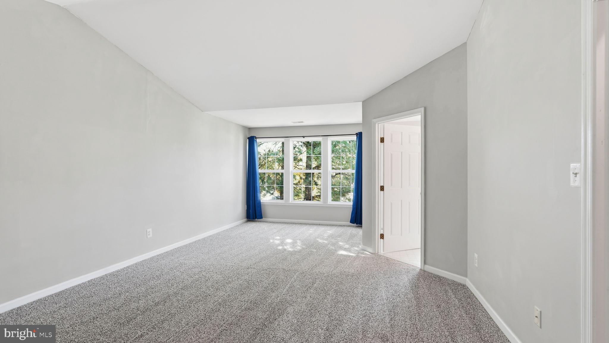 14431 Colonel Wood Road Gainesville, VA 20155 - Photo 32 of 37 a view of a big room with windows and chandelier fan