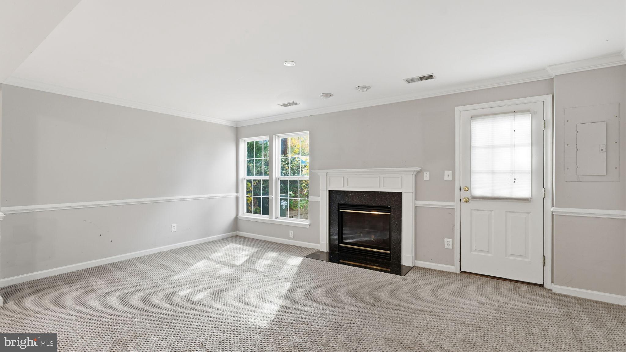 14431 Colonel Wood Road Gainesville, VA 20155 - Photo 37 of 37 an empty room with windows and fireplace