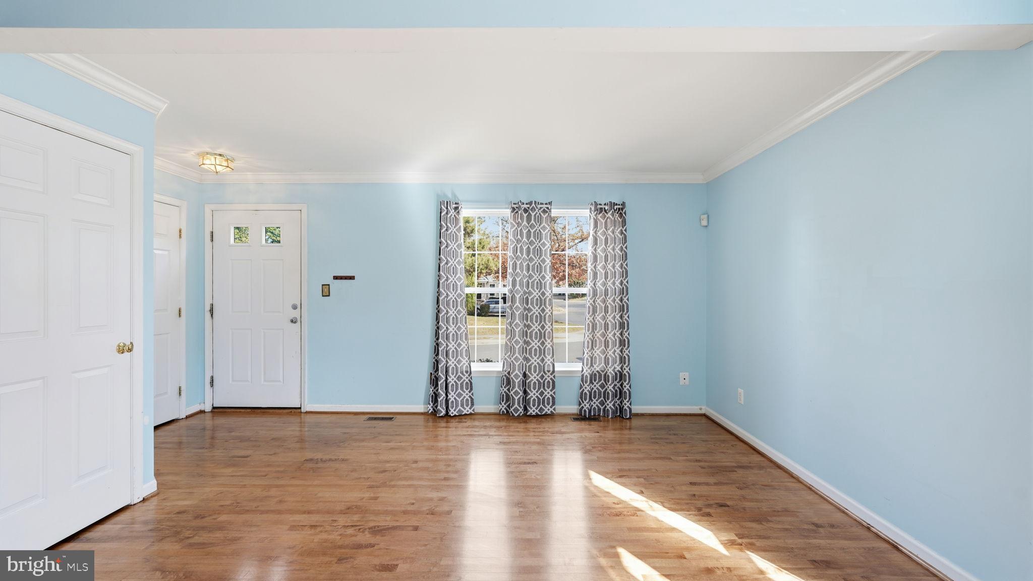 14431 Colonel Wood Road Gainesville, VA 20155 - Photo 5 of 37 wooden floor in an empty room with a window