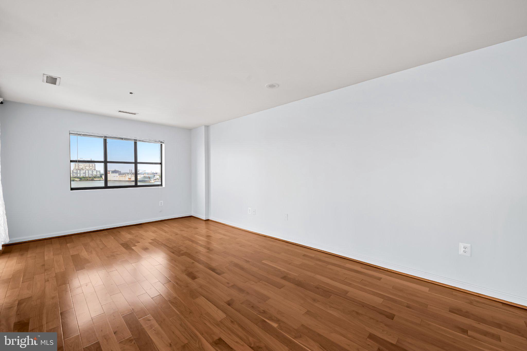 2702 Lighthouse Point East, Unit 738 Baltimore, MD 21224 - Photo 14 of 33 Spacious room with natural light.