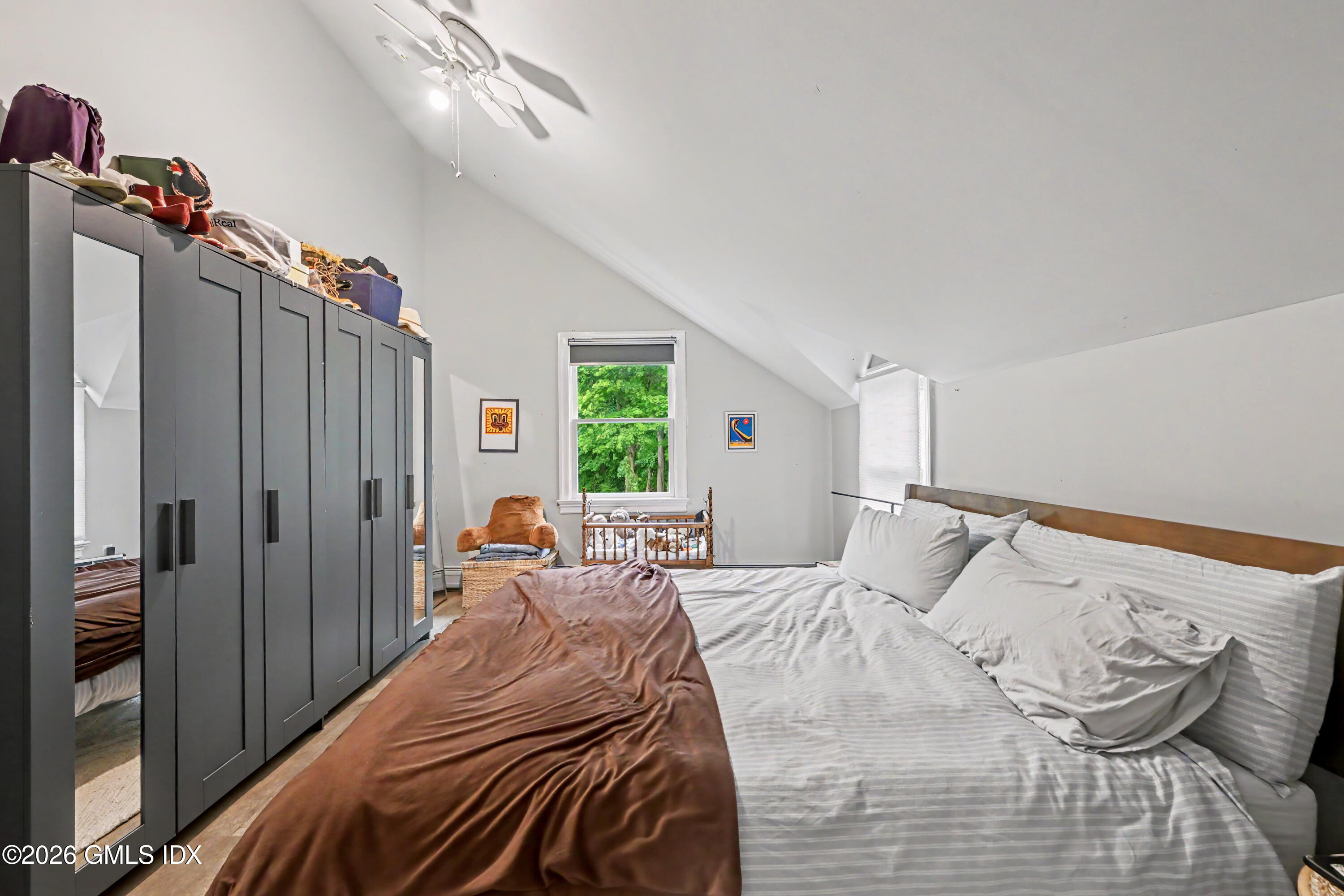 37 Prospect Street Greenwich, CT 06830 - Photo 26 of 41 a bedroom with a bed and a chandelier