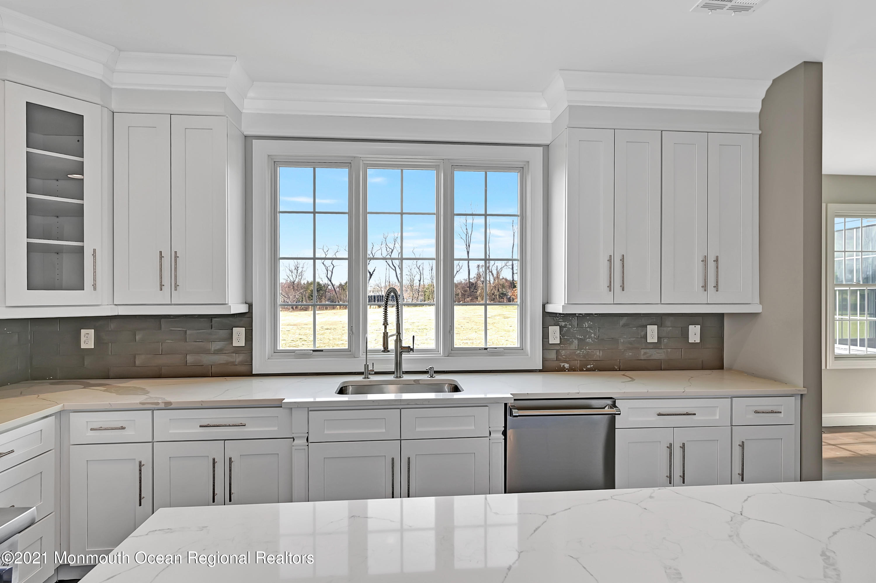 3 Cook Court Millstone Township, NJ 08535 - Photo 12 of 40 a kitchen with granite countertop white cabinets sink and window