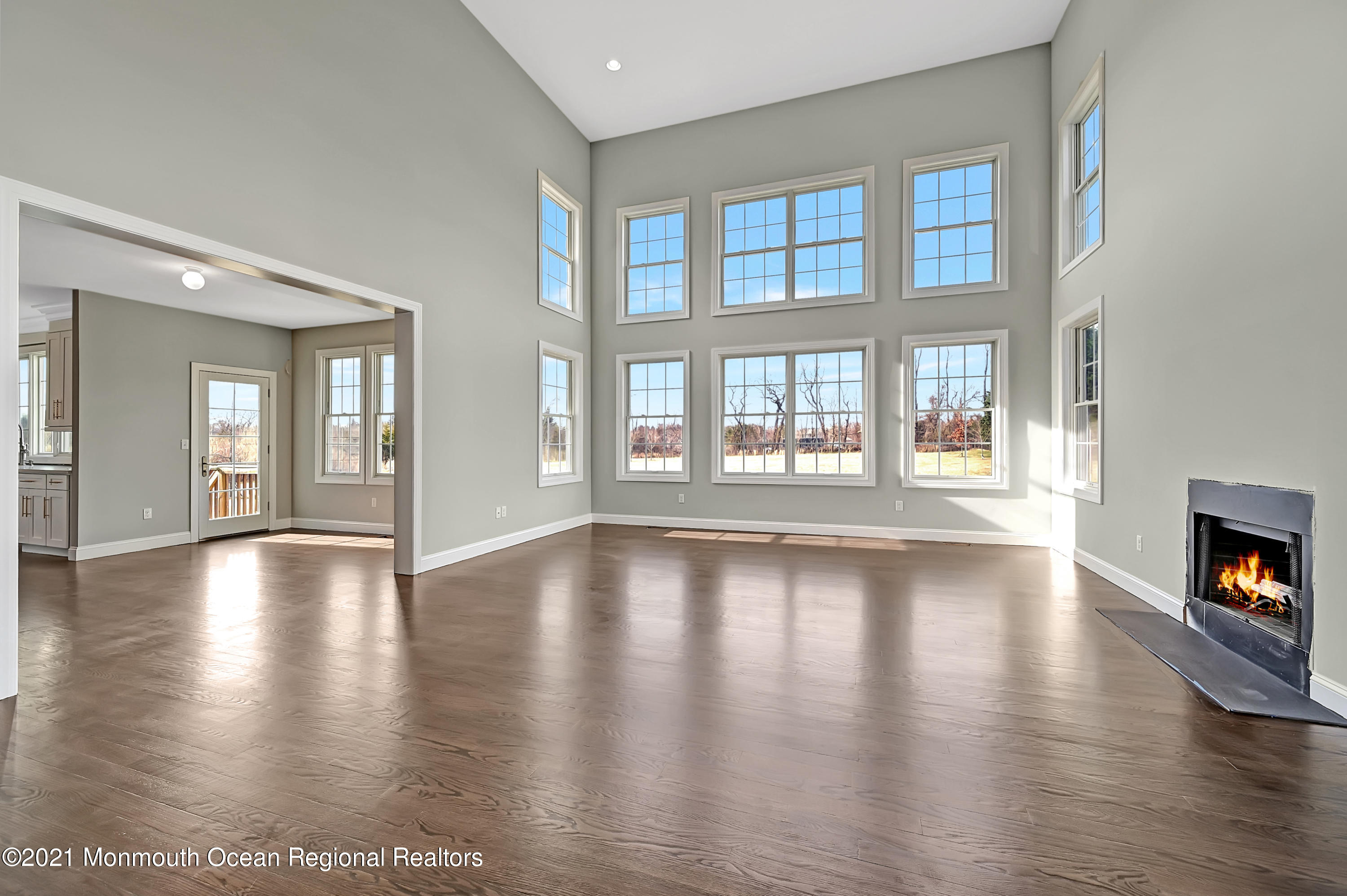 3 Cook Court Millstone Township, NJ 08535 - Photo 13 of 40 a view of an empty room with window and wooden floor