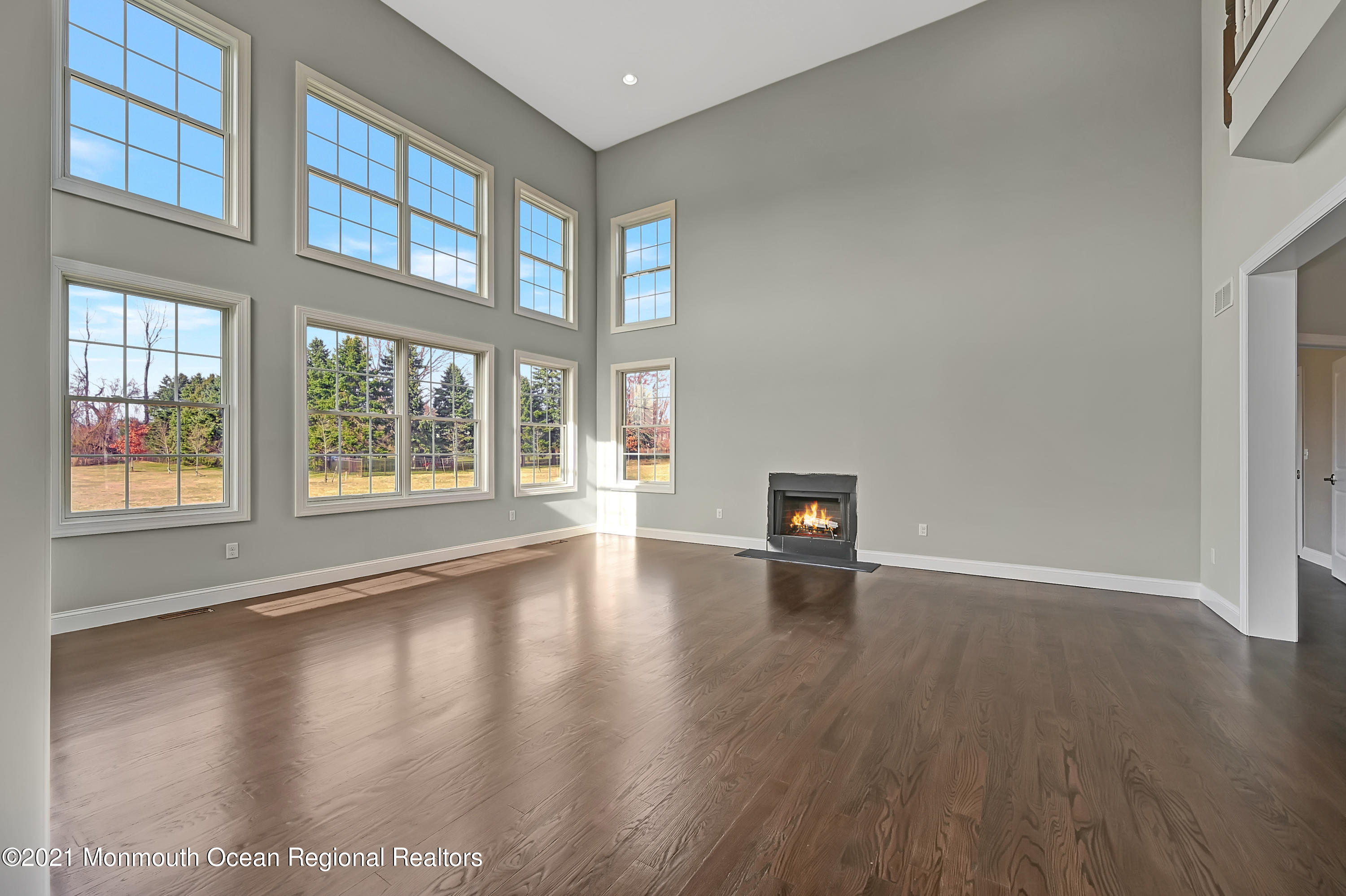 3 Cook Court Millstone Township, NJ 08535 - Photo 14 of 40 a view of an empty room with wooden floor and a window
