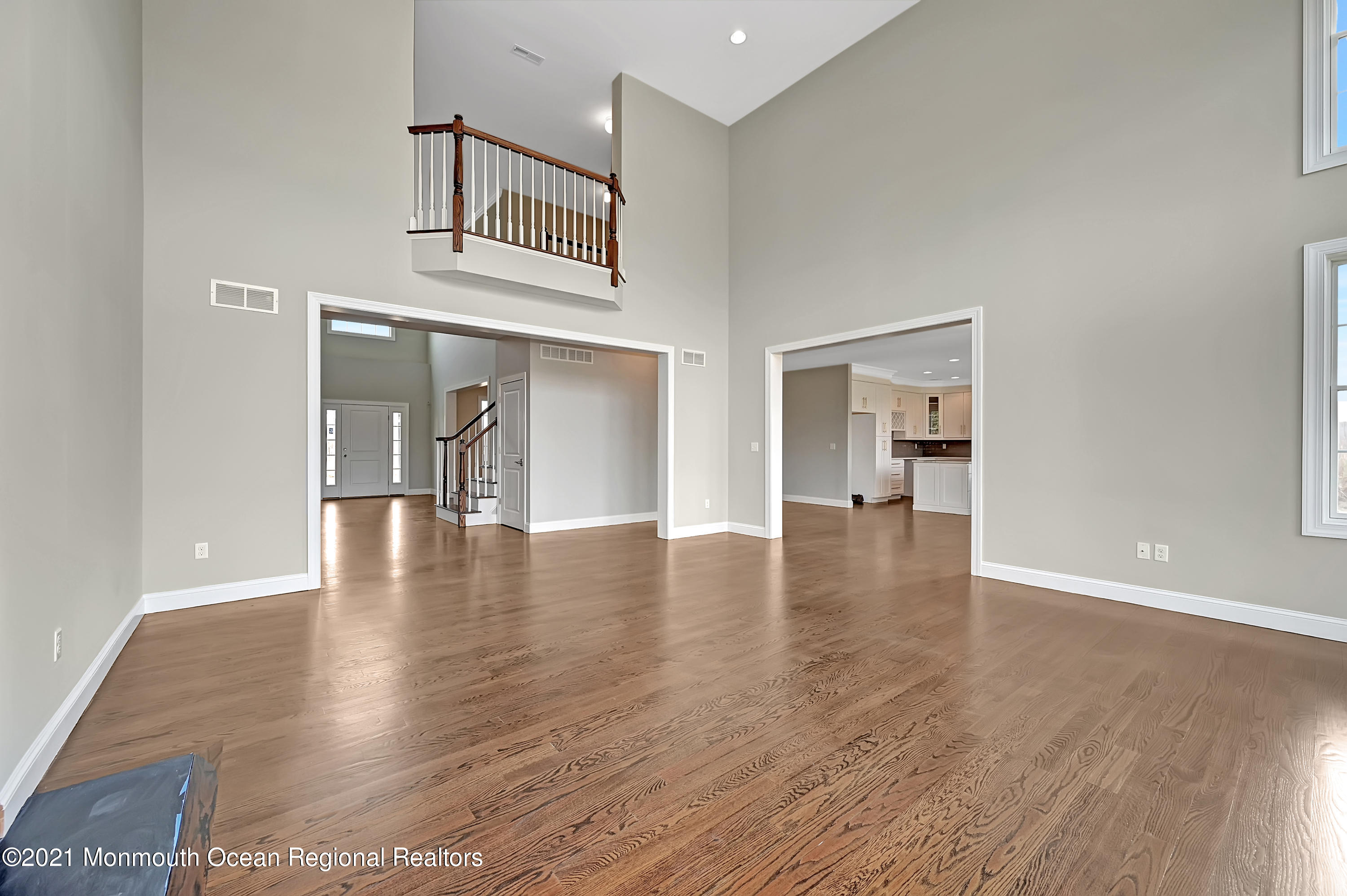 3 Cook Court Millstone Township, NJ 08535 - Photo 15 of 40 a view of empty room with wooden floor and kitchen