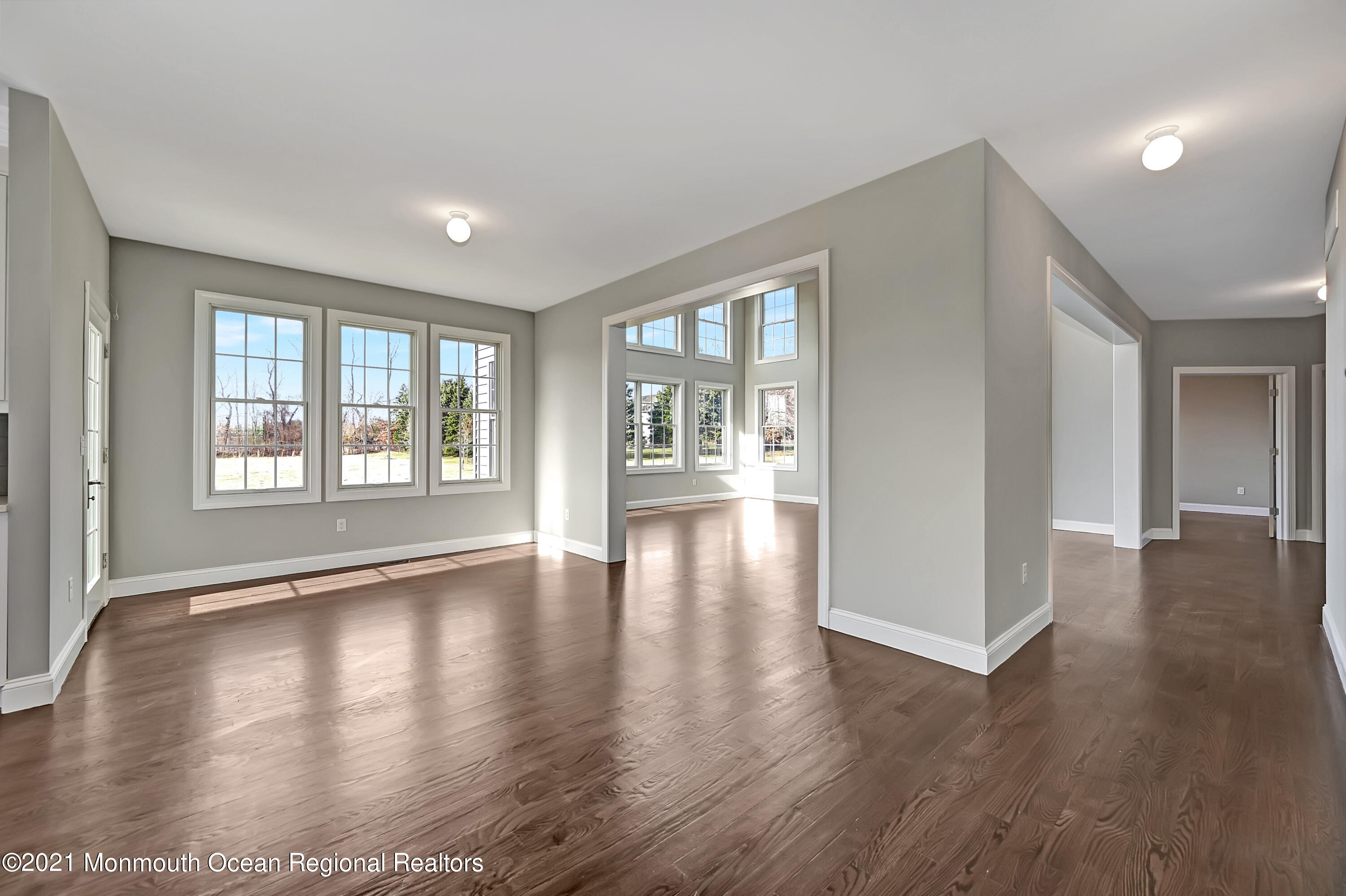3 Cook Court Millstone Township, NJ 08535 - Photo 16 of 40 a view of an empty room with wooden floor and a window