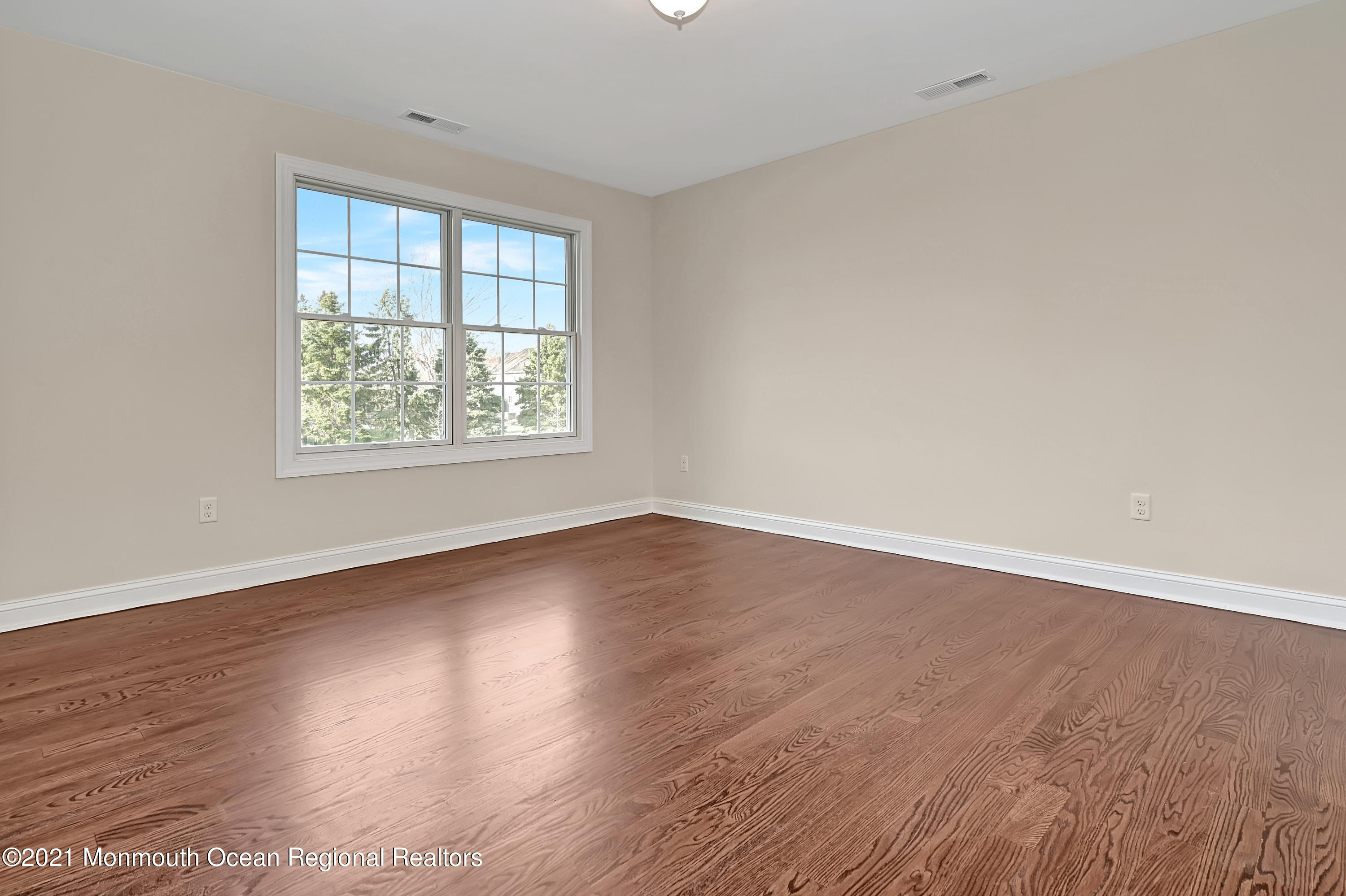 3 Cook Court Millstone Township, NJ 08535 - Photo 21 of 40 an empty room with wooden floor and windows