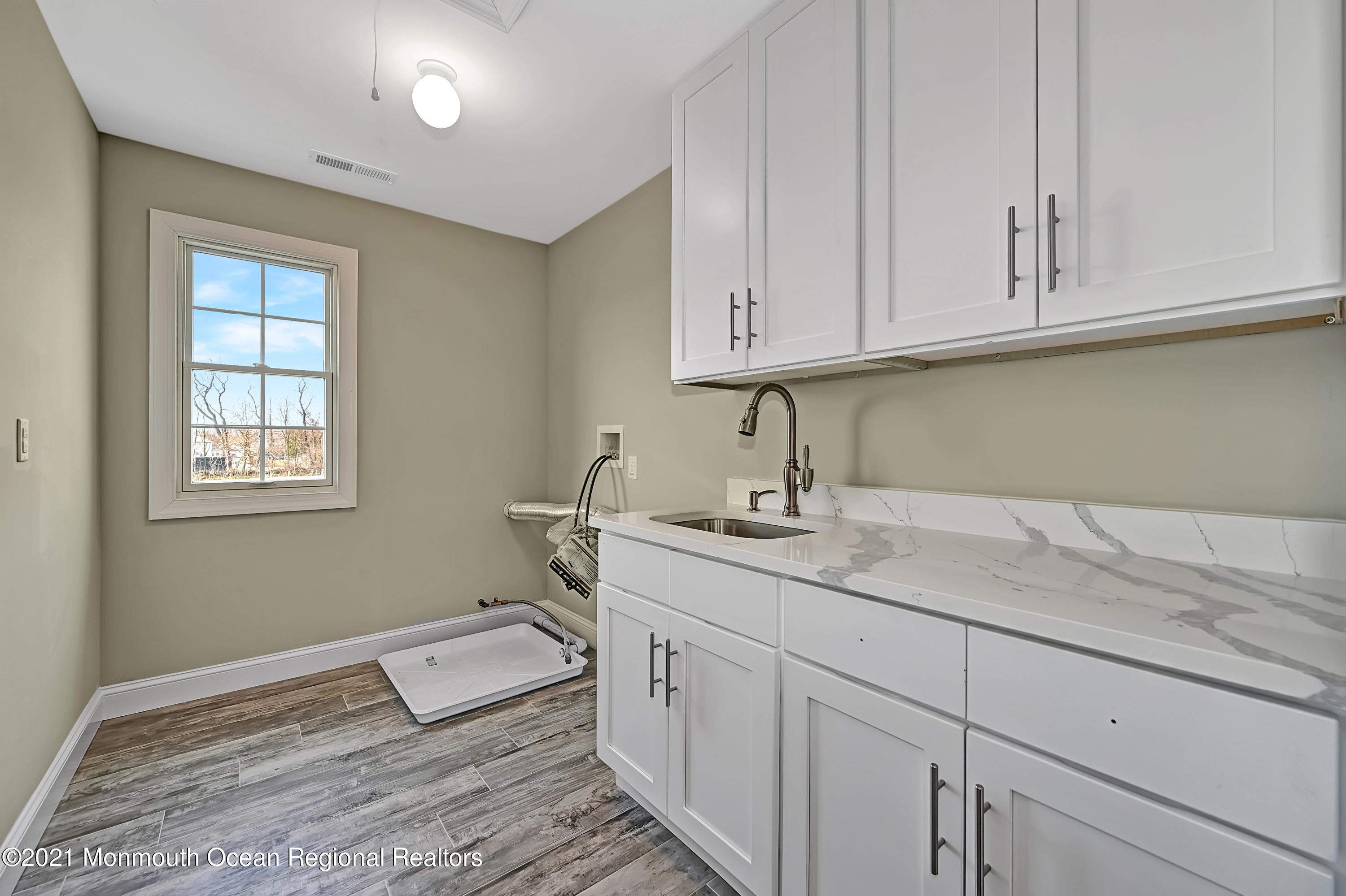 3 Cook Court Millstone Township, NJ 08535 - Photo 25 of 40 a room with a sink and cabinets