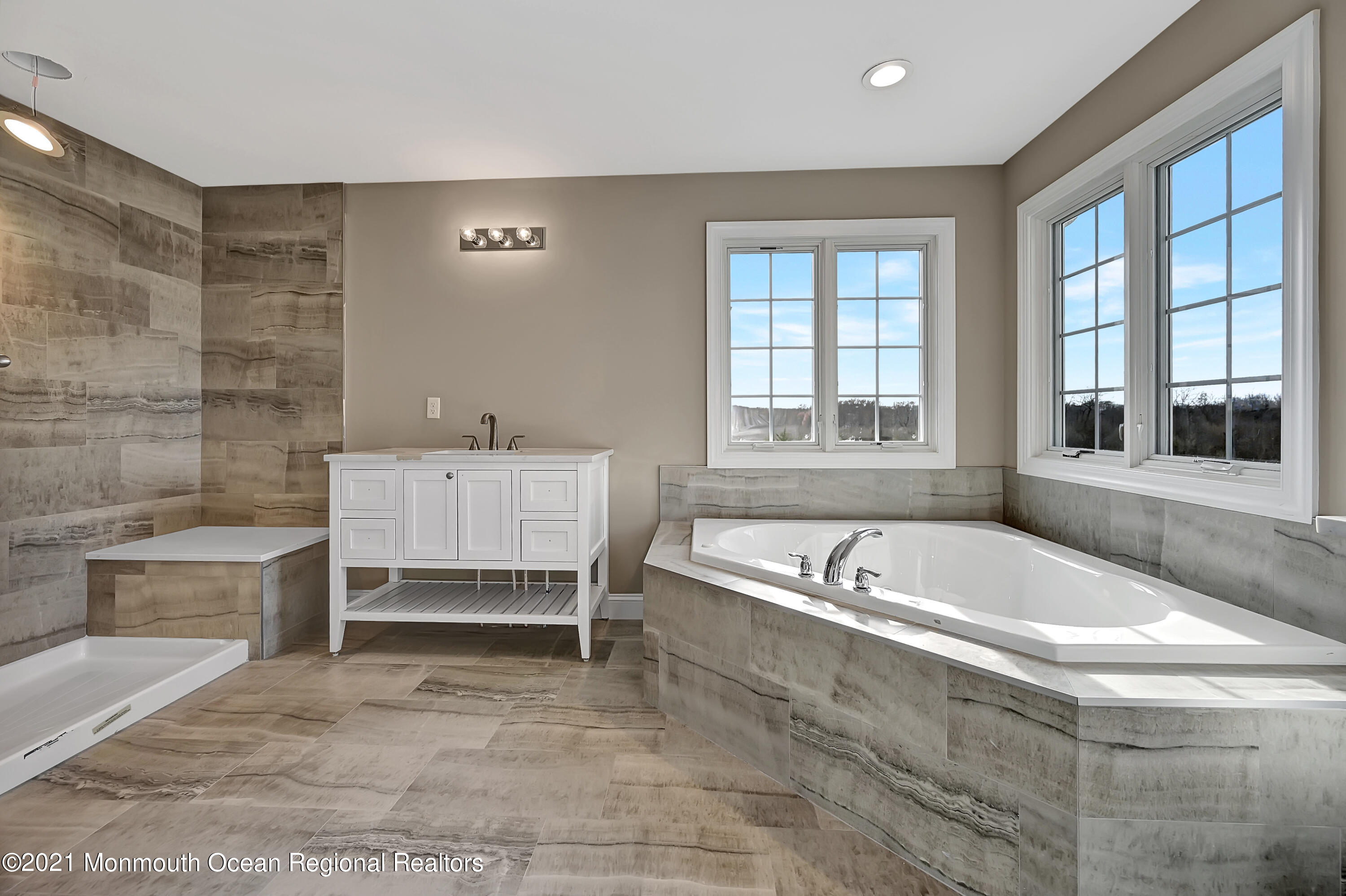 3 Cook Court Millstone Township, NJ 08535 - Photo 27 of 40 a spacious bathroom with a bathtub and a sink