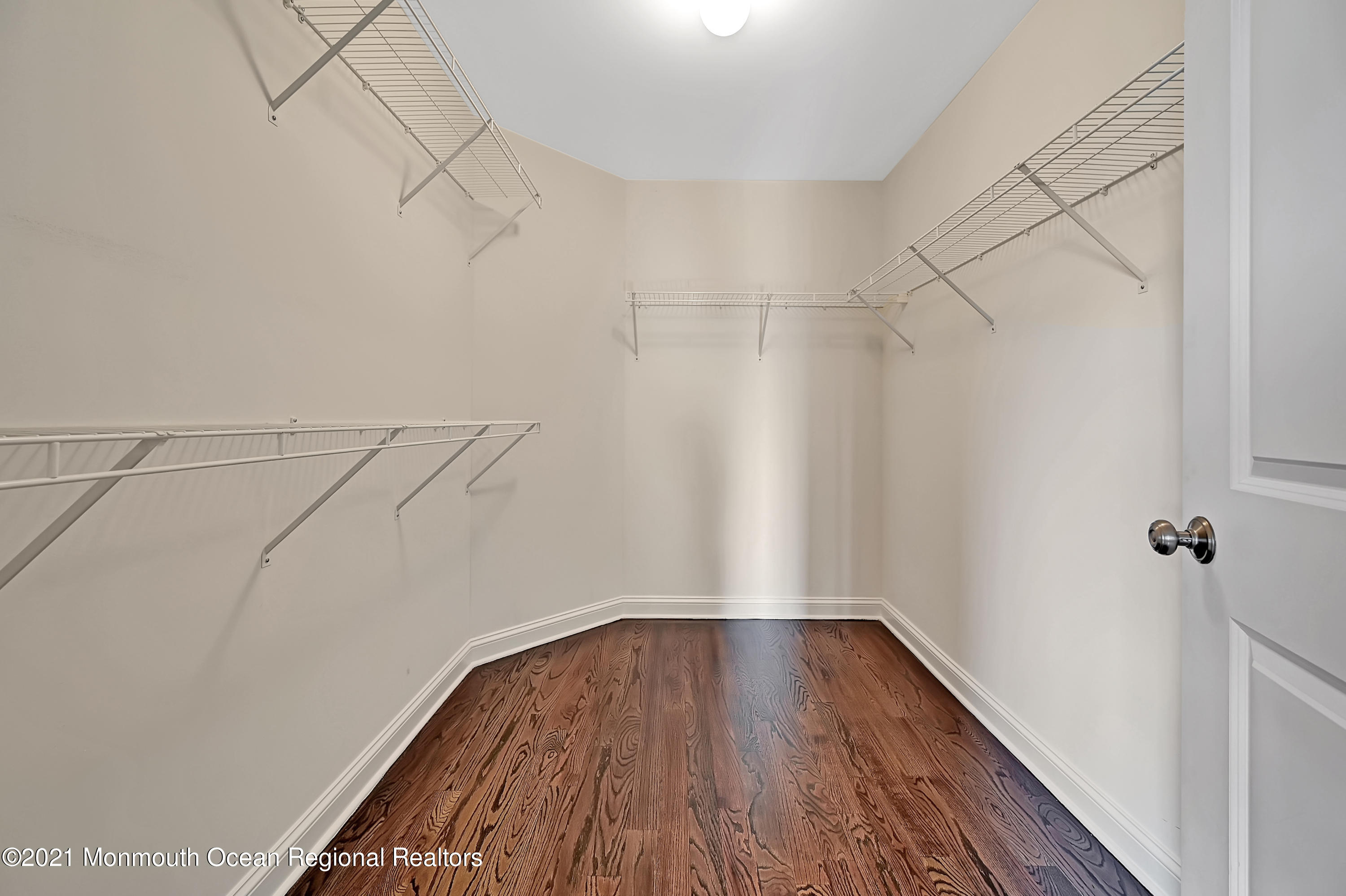 3 Cook Court Millstone Township, NJ 08535 - Photo 31 of 40 a view of a room with racks on the wall