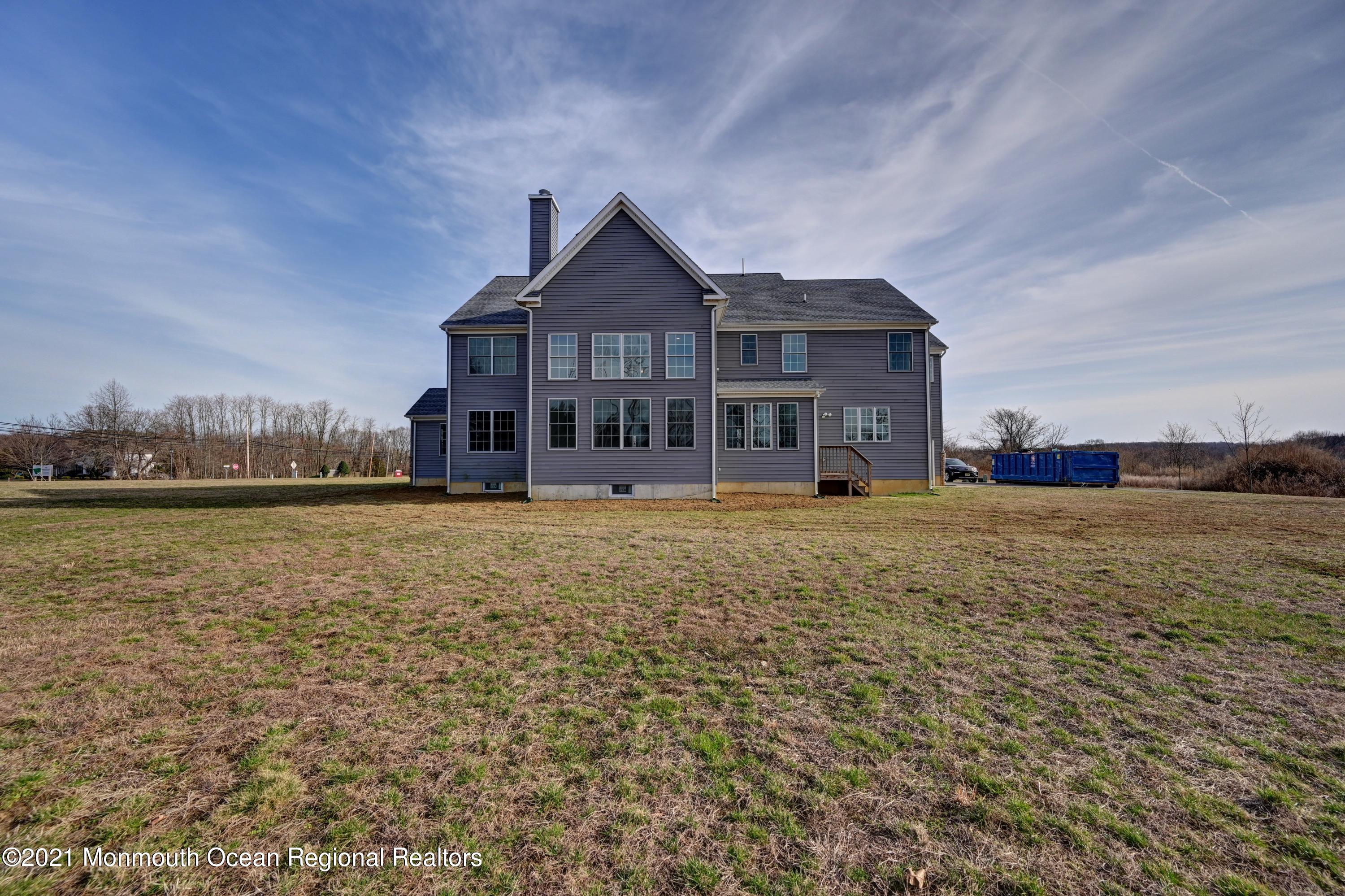 3 Cook Court Millstone Township, NJ 08535 - Photo 35 of 40 a front view of a house with a yard