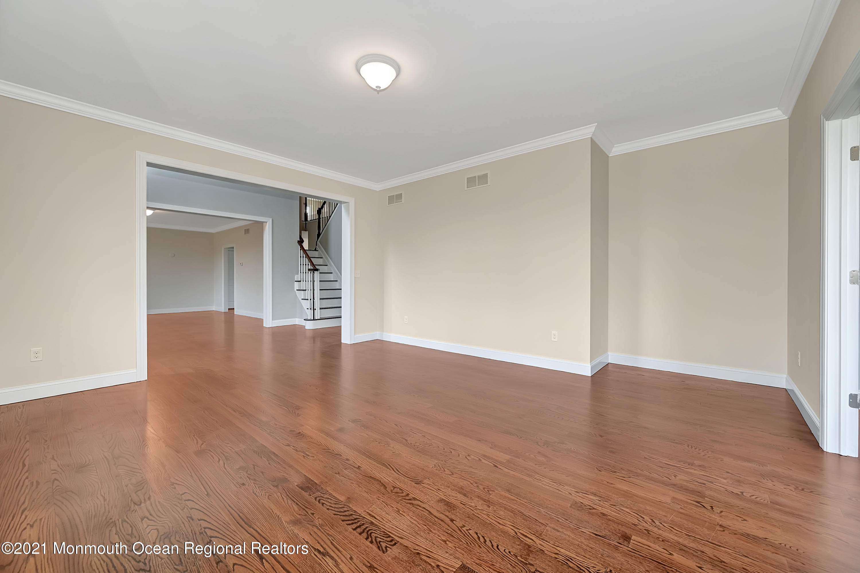 3 Cook Court Millstone Township, NJ 08535 - Photo 7 of 40 a view of an empty room with wooden floor and a window